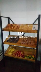 a display of different types of bread and vegetables at Lujan Homes in Luján
