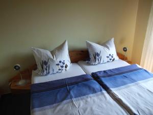 En eller flere senge i et værelse på Haus Antje + 3 billeder