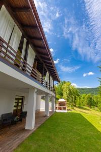 an exterior view of a house with a green lawn at B&B Green Serenity Plitvice Lakes in Plitvička Jezera