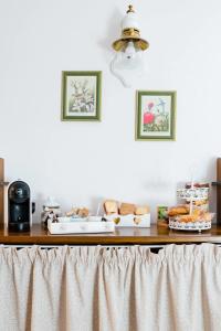 a table with bread and pastries on top of it at TRENTINO LODGE Via San Vito in Strigno