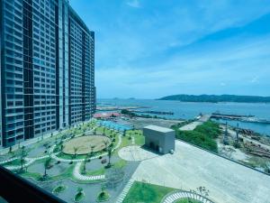 a view of a city from a building at JQ1 SEA & POOL or CITY View WIFI I WASHING MACHINE for Seaview unit I CUCKOO WATER Jesselton Quay by R2 in Kota Kinabalu