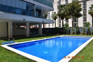 a large swimming pool in front of a building at Sea view and Ifach Calpe in Calpe