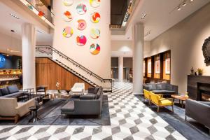 a lobby of a hotel with couches and chairs at Le Méridien Columbus, The Joseph in Columbus