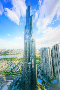 an aerial view of a tall skyscraper in a city at MOTT HAVEN APART - Vinhomes Central Park in Ho Chi Minh City