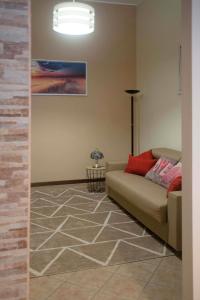 Posezení v ubytování Appartamento Timeless con piscina e tennis + 16 fotografií