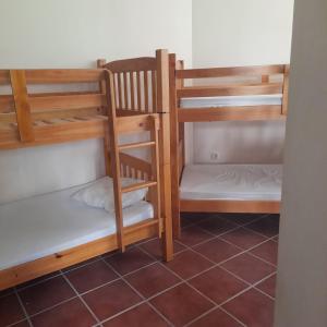 two sets of bunk beds in a room at Albergue La Pinilla in Madrid