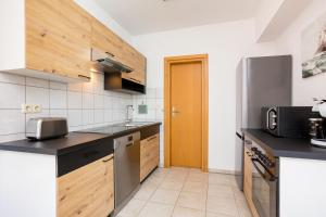 Kuchyň nebo kuchyňský kout v ubytování Apartments Sara