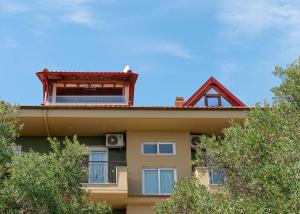 a building with a bird sitting on top of it at EVERGREEN apartment in Nea Moudania