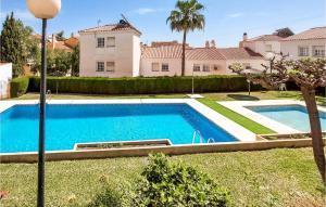 a swimming pool in the yard of a house at Stunning Home In Torre De Benagalbon With Outdoor Swimming Pool in Torre de Benagalbón