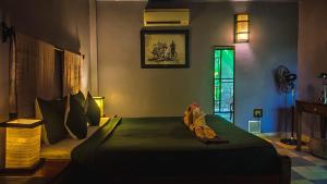 Letto o letti in una camera di Au Cabaret Vert