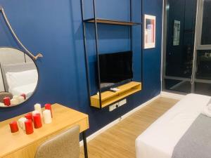 Postel nebo postele na pokoji v ubytování Ceylonz Suites by ROOMY