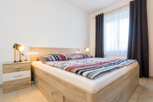 Postel nebo postele na pokoji v ubytování Apartments Sara