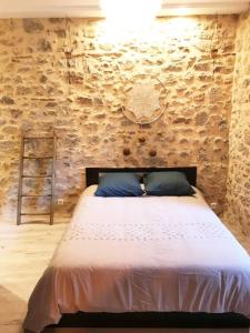 Postel nebo postele na pokoji v ubytování Du haut des remparts