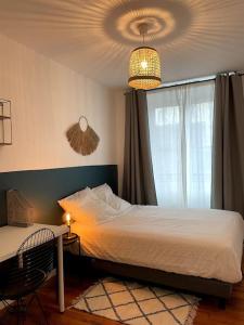 Posteľ alebo postele v izbe v ubytovaní Appartement en Centre-Ville