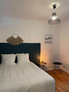 Posteľ alebo postele v izbe v ubytovaní Appartement en Centre-Ville