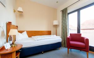 Ένα ή περισσότερα κρεβάτια σε δωμάτιο στο Hotel und Restaurant Haus Sajons