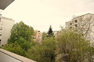 a view of a city with trees and buildings at Stinga apartment in Zagreb