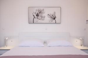 Postel nebo postele na pokoji v ubytování Apartman Mala plaža 2