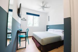 Ein Bett oder Betten in einem Zimmer der Unterkunft The Concept Hotel KL - Batu Caves