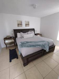 a bedroom with a large bed and two night stands at Home from Home 5 bedroom villa in Davenport