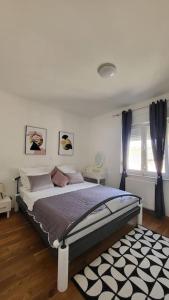 Кровать или кровати в номере Apartment COCO