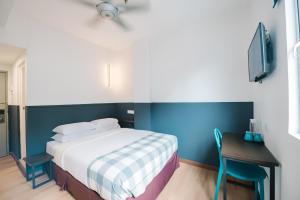 Ein Bett oder Betten in einem Zimmer der Unterkunft The Concept Hotel KL - Batu Caves