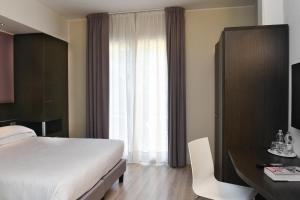 Posteľ alebo postele v izbe v ubytovaní Hotel Vienna