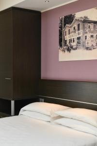 Posteľ alebo postele v izbe v ubytovaní Hotel Vienna