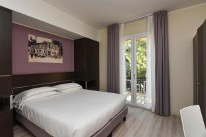 Posteľ alebo postele v izbe v ubytovaní Hotel Vienna