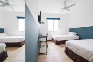 Postel nebo postele na pokoji v ubytování The Concept Hotel KL - Batu Caves