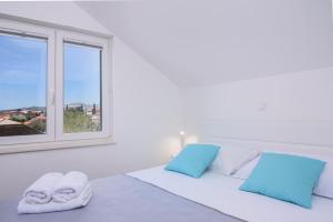 Postel nebo postele na pokoji v ubytování Apartman Mala plaža 2