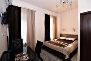 Postel nebo postele na pokoji v ubytování Comfort House Hotel