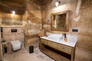 a bathroom with a sink and a toilet at Sinasos Evleri in Nevsehir +70 photos