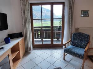 a room with a desk and a chair and a window at Schönbrunn holiday home in Bayrischzell in Bayrischzell