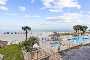 a view of the beach from the balcony of a resort at Sea Breeze 106 in St. Pete Beach