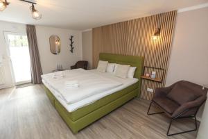 Postel nebo postele na pokoji v ubytování Falk & Frei Selketal Resort