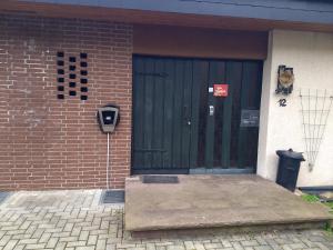 a front door of a house with a parking meter at Villa-Fuldablick in Morschen