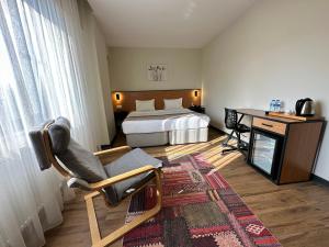 Postel nebo postele na pokoji v ubytování N'Ala Otel
