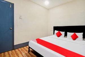 Een bed of bedden in een kamer bij Hotel Signature Homes