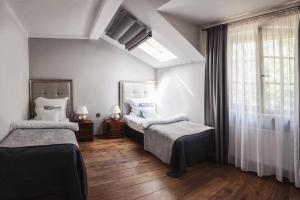 Łóżko lub łóżka w pokoju w obiekcie Constantia by Grape Hotel