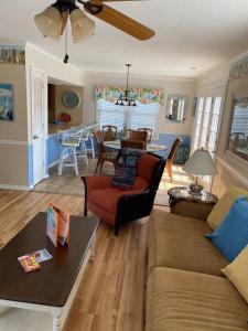 a living room with a couch and a table at Beach Breeze 3, pet friendly, walking distance to Atlantic Ocean free parking in Myrtle Beach