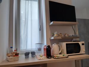 Kuchyň nebo kuchyňský kout v ubytování Piazza Mazzini Apartment