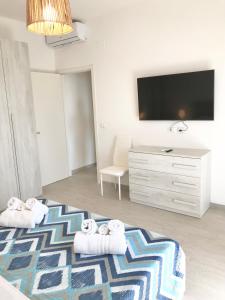 Televízia a/alebo spoločenská miestnosť v ubytovaní Casa del Sole + 10 fotografií