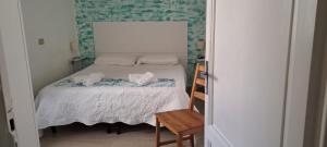 Postel nebo postele na pokoji v ubytování Hotel Canarco