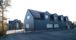 a house with solar panels on the side of it at Kassikäpa villa in Haapsalu