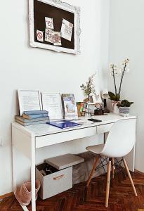 a white desk with a chair in a room at Pure of joy City Centre Apartment in Subotica