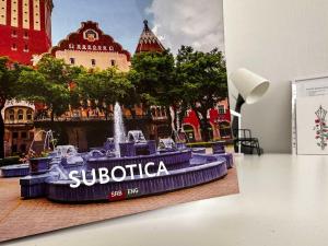 a rendering of a water fountain in front of a building at Pure of joy City Centre Apartment in Subotica