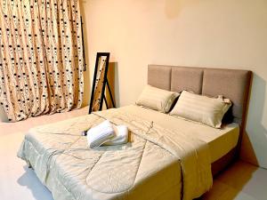 Кровать или кровати в номере Homestay D Razak Wakaf Tapai
