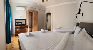 Кровать или кровати в номере Palm Konak Hotel