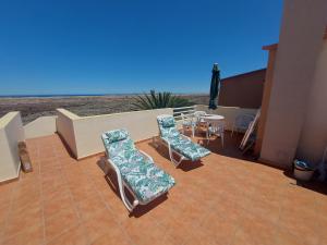 En balkon eller terrasse på Casa Marilú